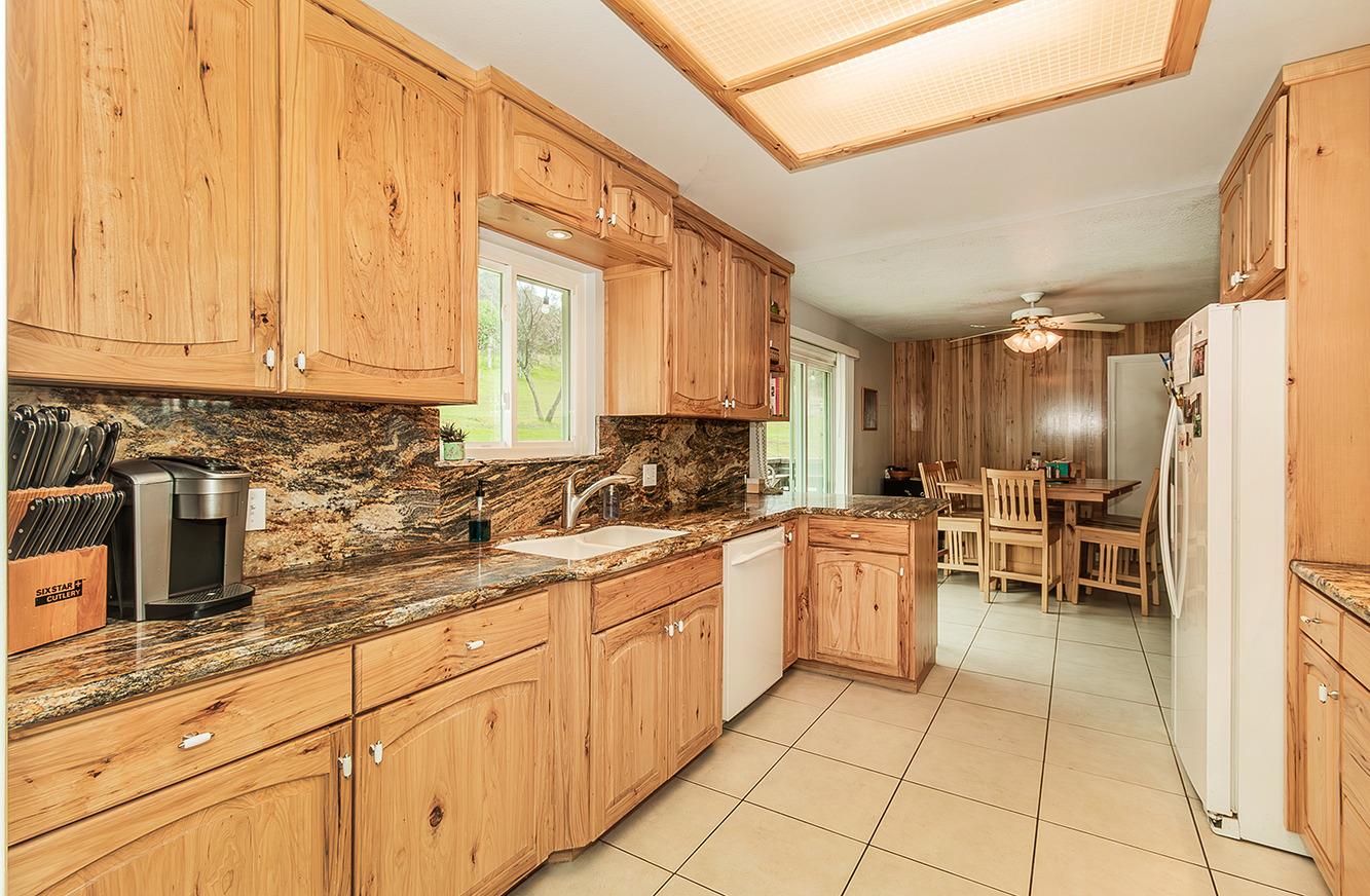 29979 Post Oak Road Tollhouse, CA 93667 - Photo 14 of 42 a kitchen with a sink and cabinets