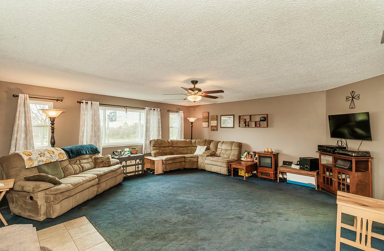 29979 Post Oak Road Tollhouse, CA 93667 - Photo 16 of 42 a living room with furniture and a flat screen tv