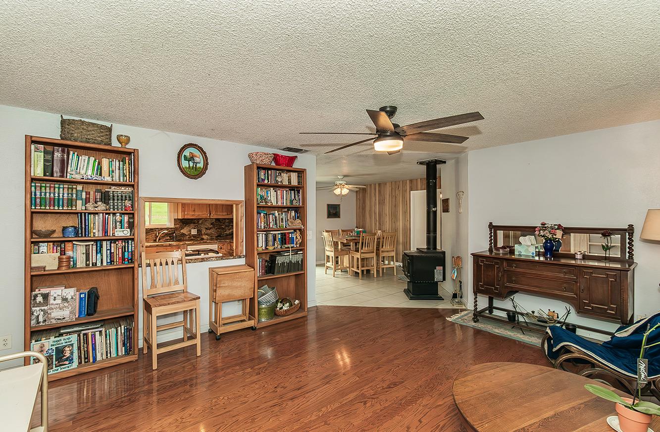 29979 Post Oak Road Tollhouse, CA 93667 - Photo 18 of 42 a work room with furniture wooden floor and a book shelf