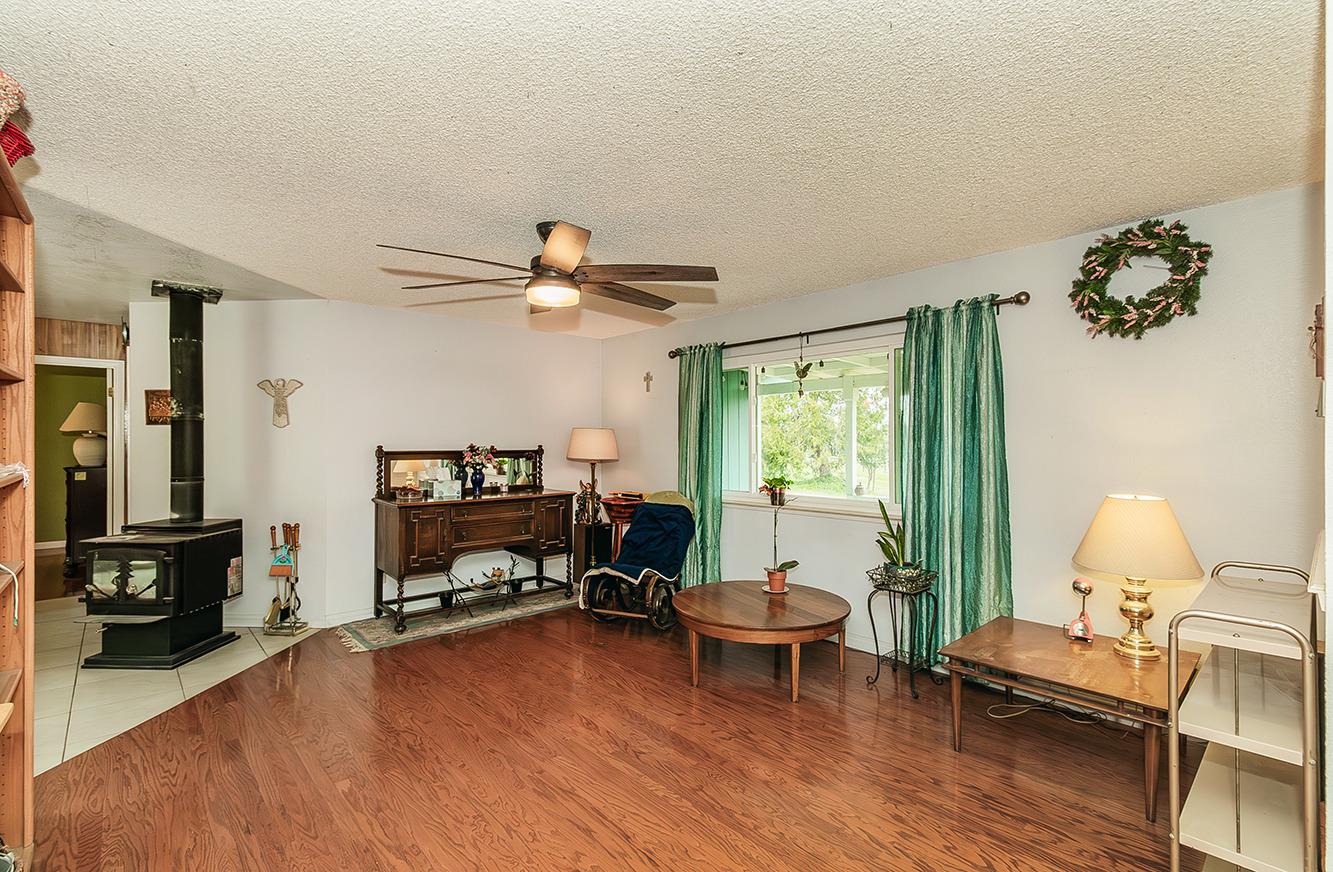 29979 Post Oak Road Tollhouse, CA 93667 - Photo 19 of 42 a living room with furniture and a wooden floor