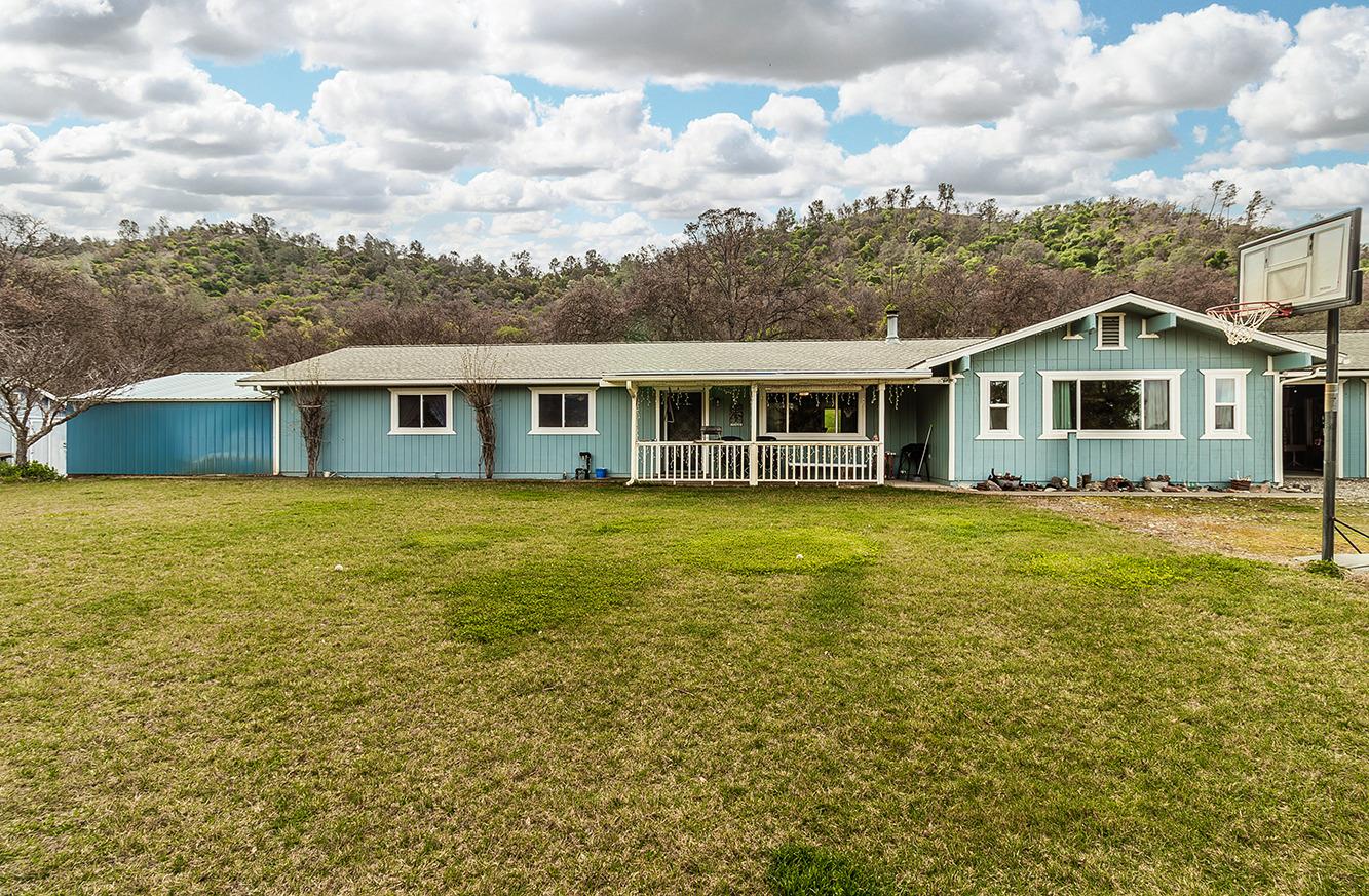 29979 Post Oak Road Tollhouse, CA 93667 - Photo 2 of 42 a view of a house with a big yard and potted plants