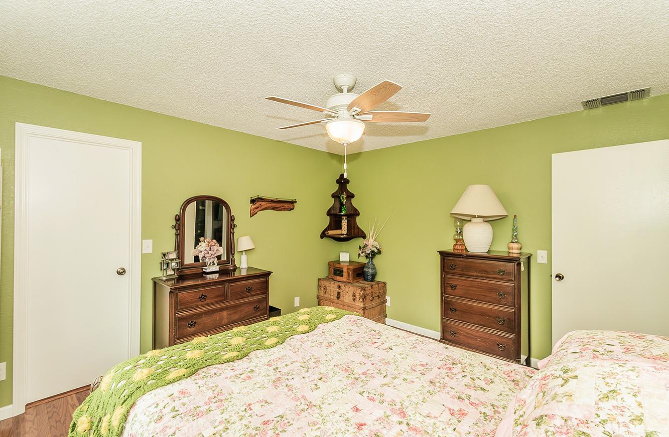 29979 Post Oak Road Tollhouse, CA 93667 - Photo 25 of 42 a bedroom with a bed and dresser with mirror