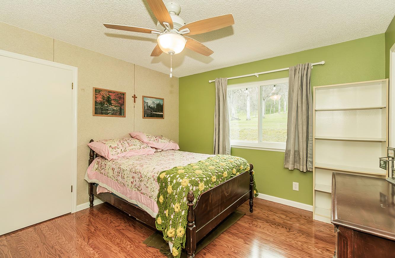 29979 Post Oak Road Tollhouse, CA 93667 - Photo 26 of 42 a bedroom with a bed and a window
