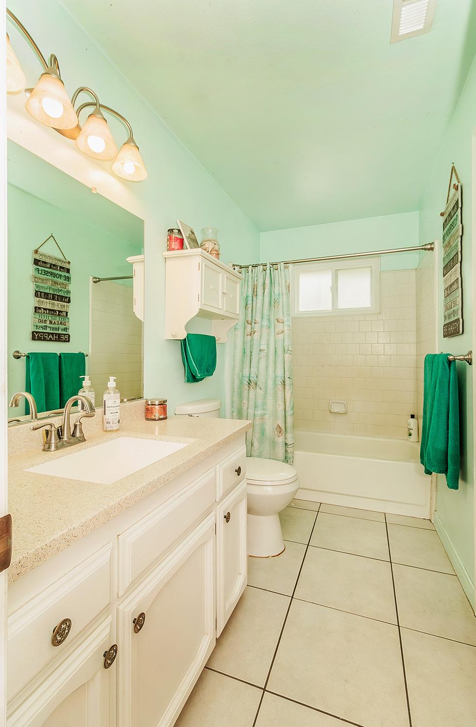 29979 Post Oak Road Tollhouse, CA 93667 - Photo 29 of 42 a spacious bathroom with a granite countertop sink a toilet and a mirror