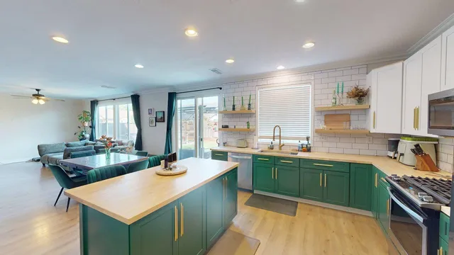 a kitchen with counter top space sink and stove