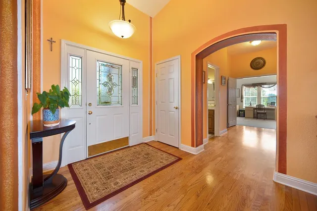a living room with furniture ceiling fan and a rug