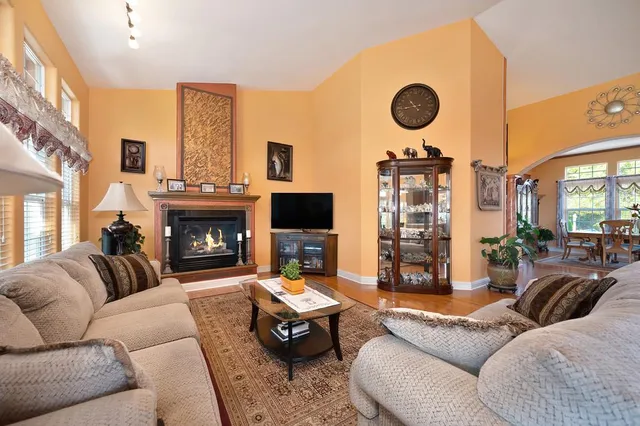 a kitchen with stainless steel appliances granite countertop a refrigerator a stove and a sink with cabinets