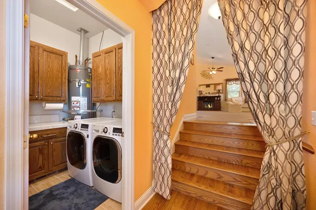 a en suite bathroom with a granite countertop sink and a mirror