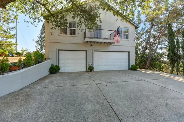 a front view of a house with garage