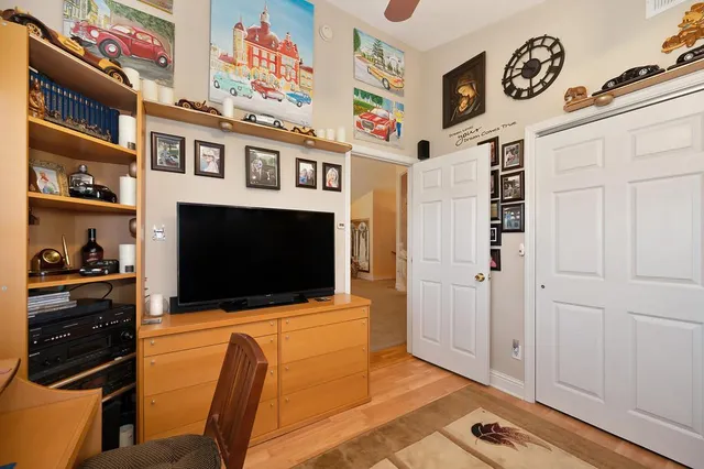 a bedroom with a bed and a dresser