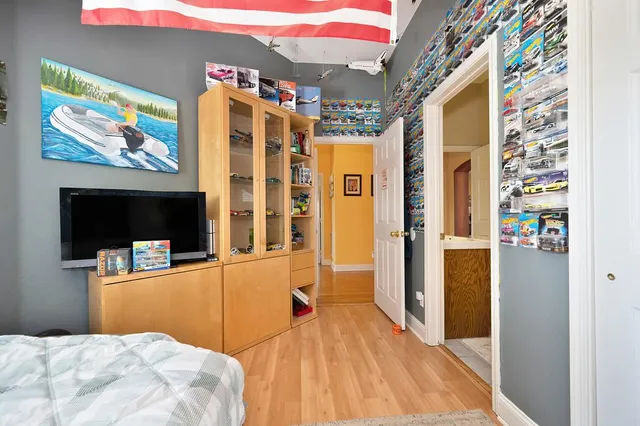 a view of a chairs and table in patio with a lake view