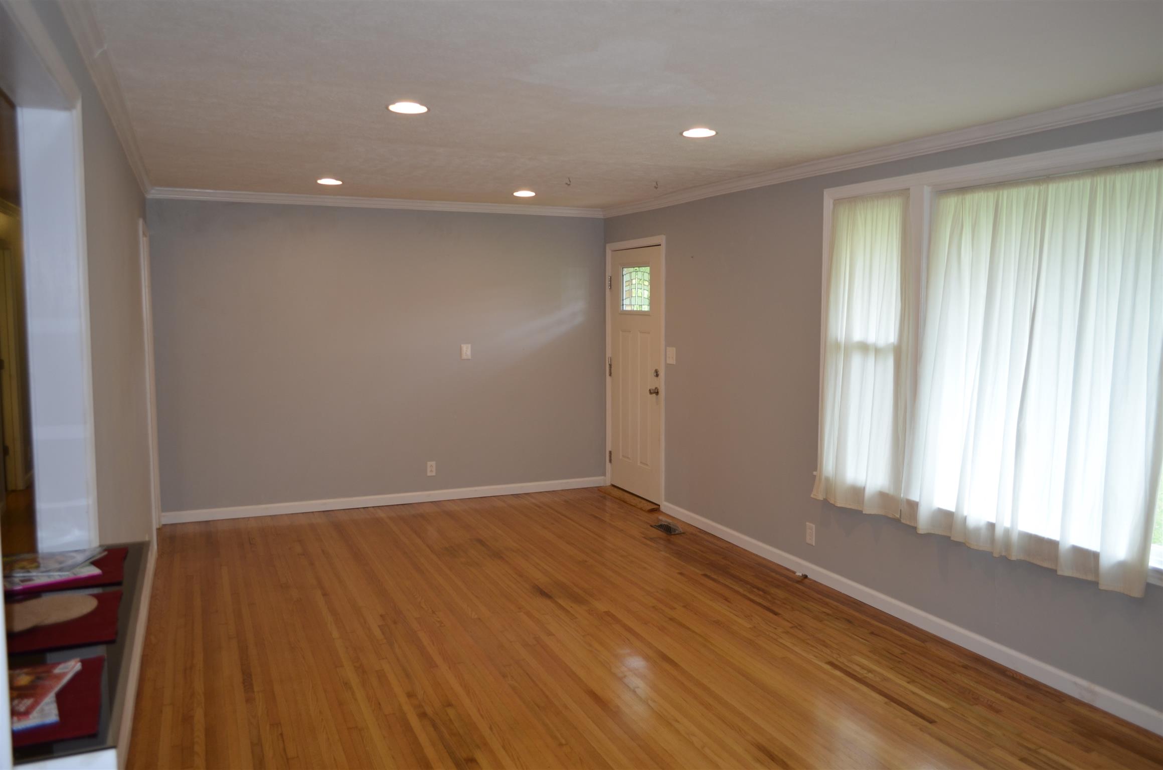 312 Burch Road Clarksville, TN 37042 - Photo 13 of 22 an empty room with wooden floor and windows