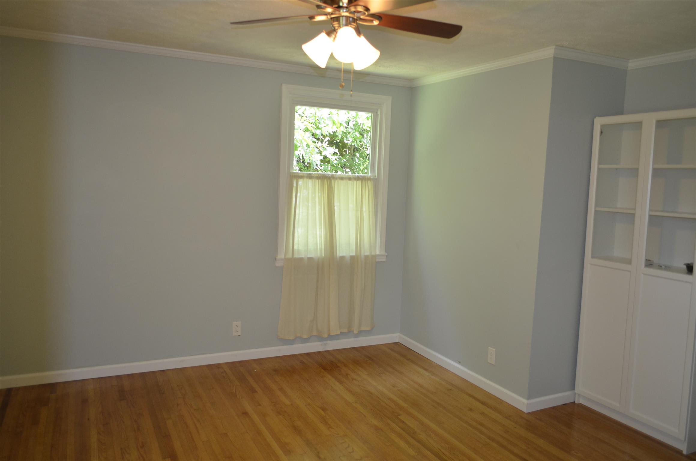 312 Burch Road Clarksville, TN 37042 - Photo 16 of 22 an empty room with wooden floor and windows