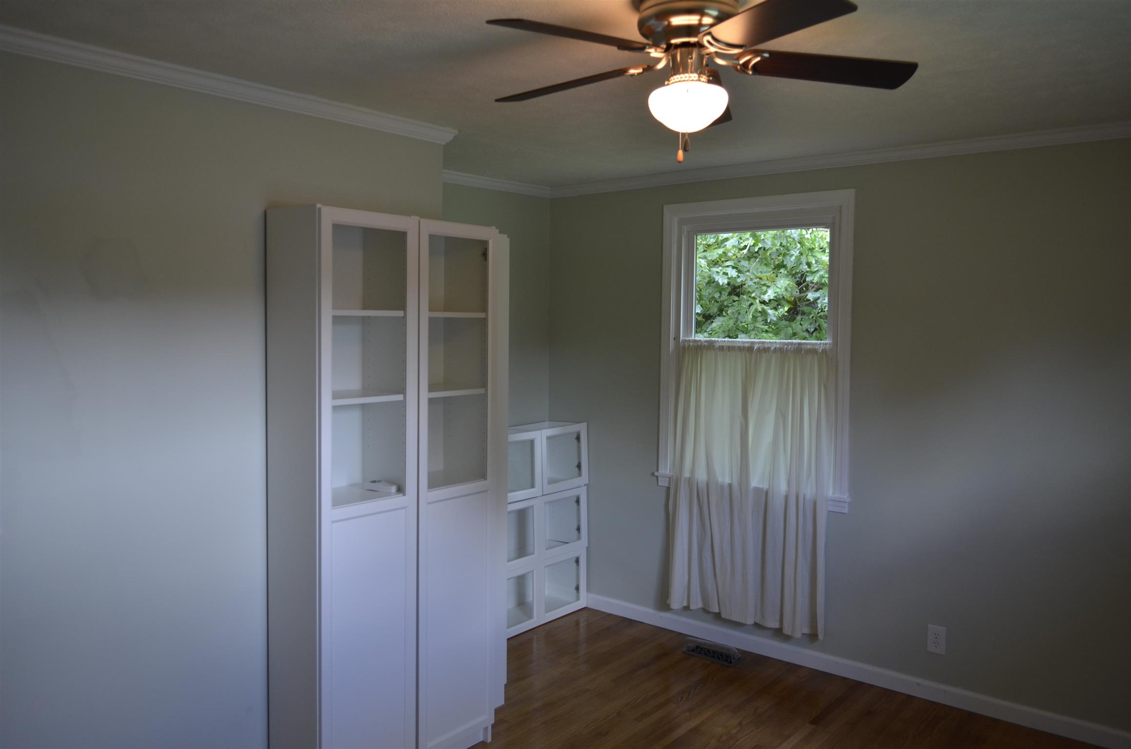 312 Burch Road Clarksville, TN 37042 - Photo 20 of 22 an empty room with wooden floor closet and windows