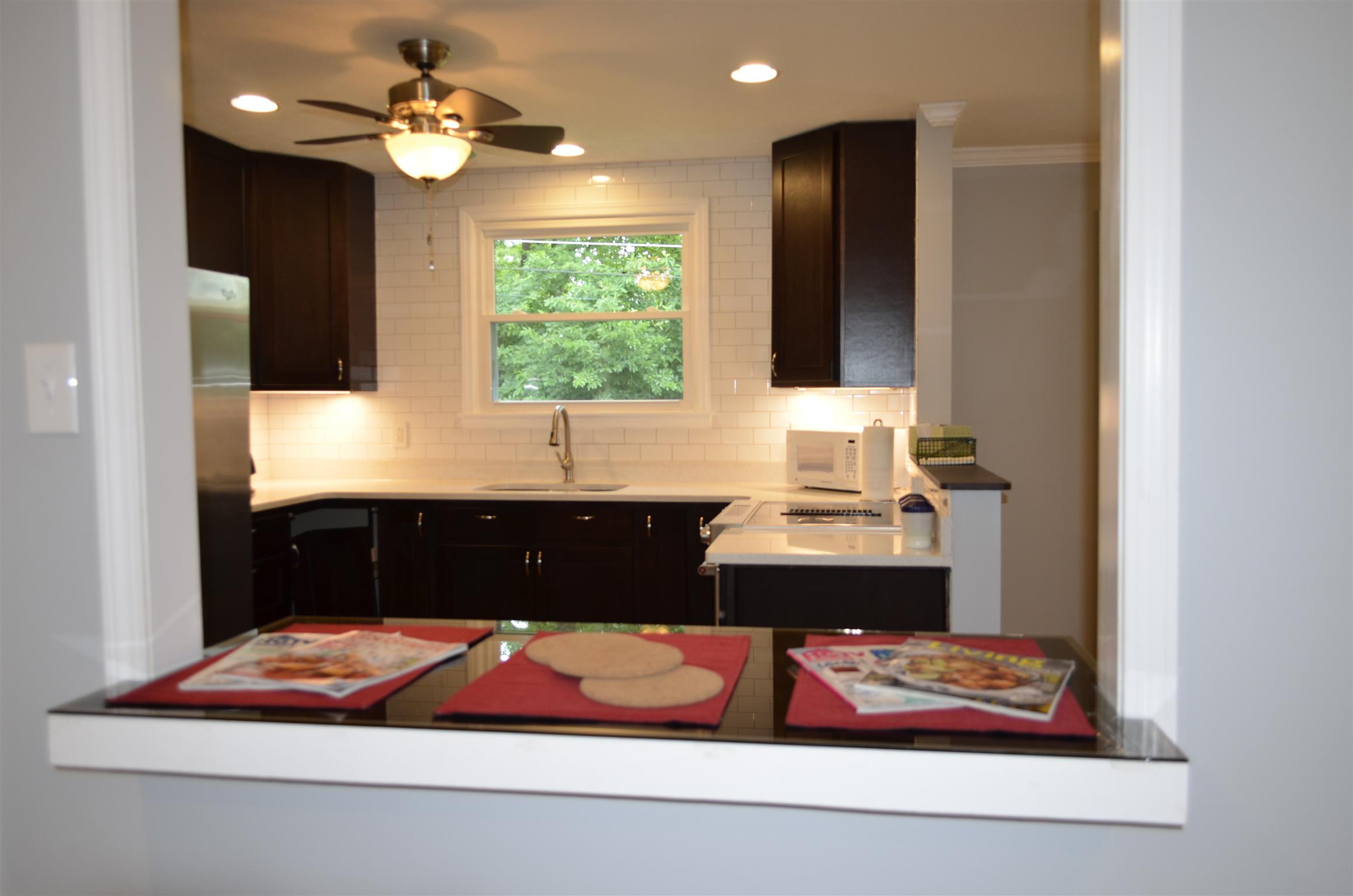 312 Burch Road Clarksville, TN 37042 - Photo 22 of 22 a room with a large bed and a chandelier
