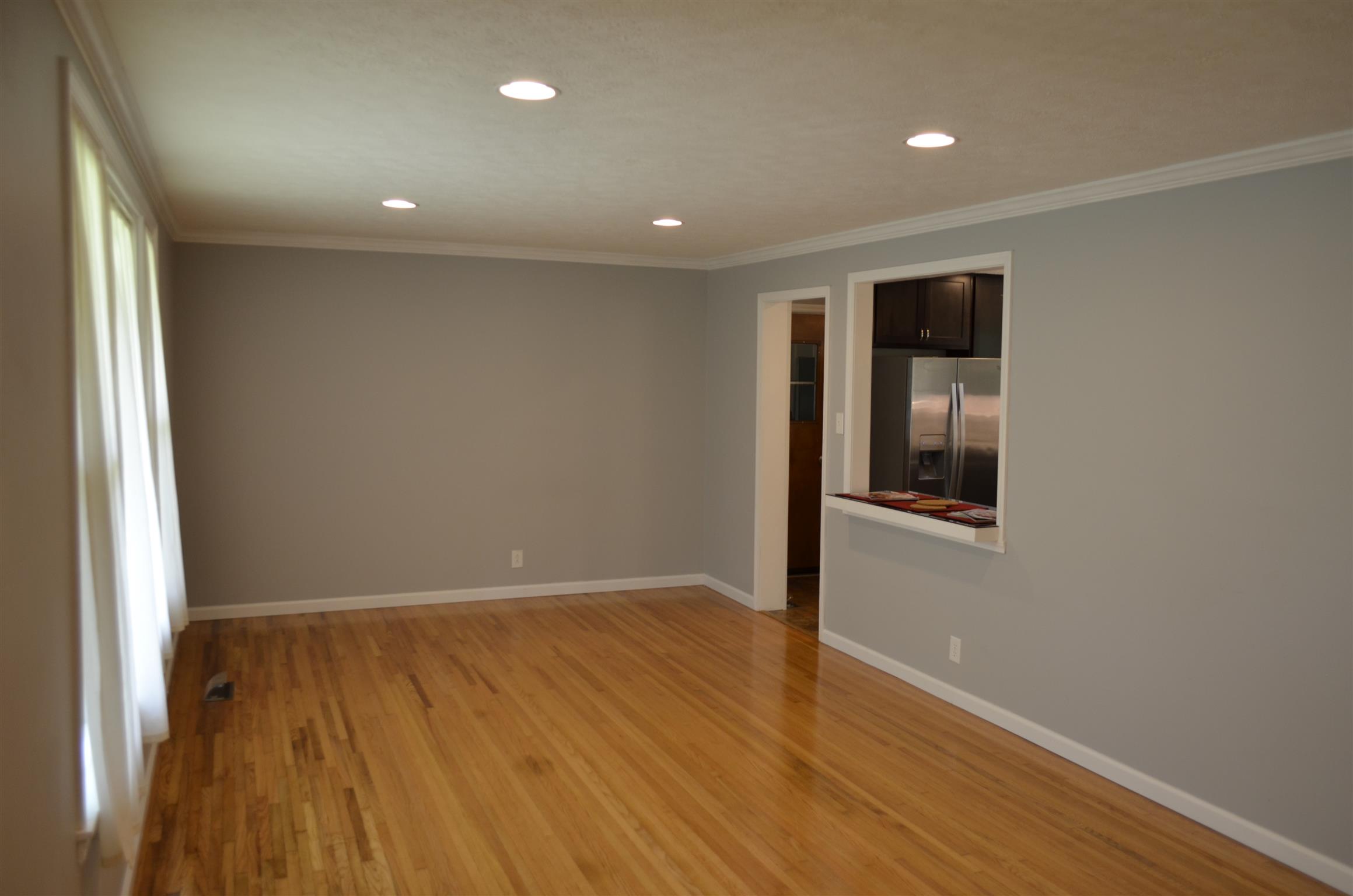 312 Burch Road Clarksville, TN 37042 - Photo 6 of 22 an empty room with wooden floor and windows