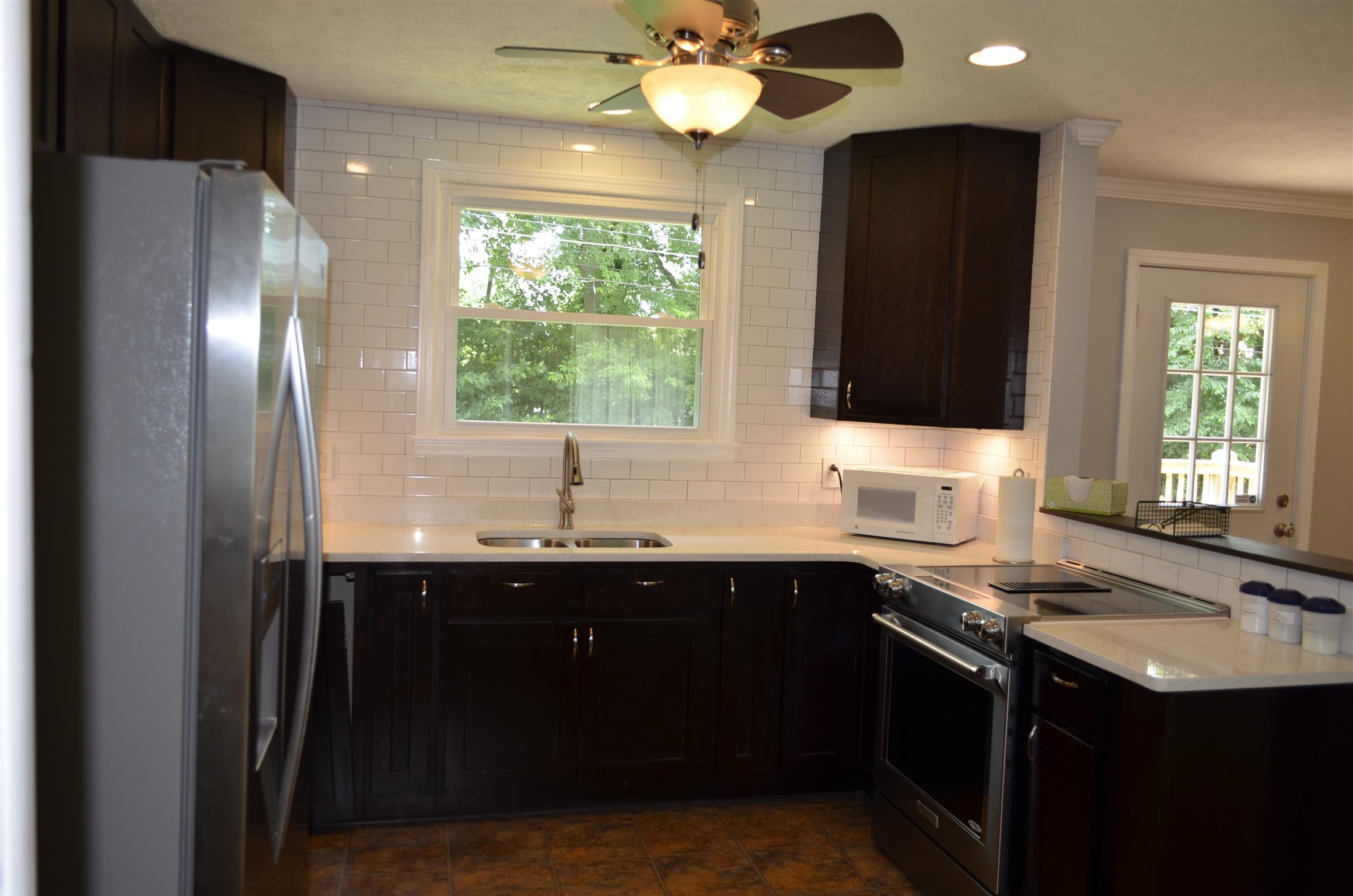 312 Burch Road Clarksville, TN 37042 - Photo 10 of 22 a kitchen with a sink and a refrigerator