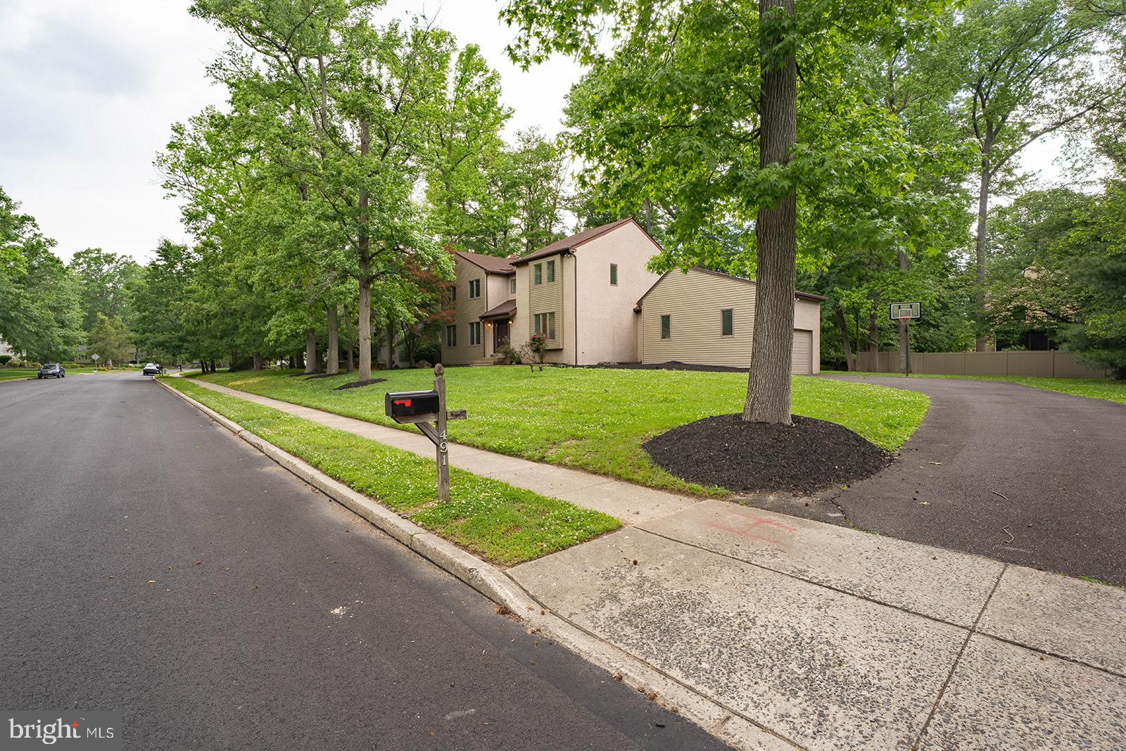 491 Kings Road Yardley, PA 19067 - Photo 5 of 52 a front view of a house with a yard and tree