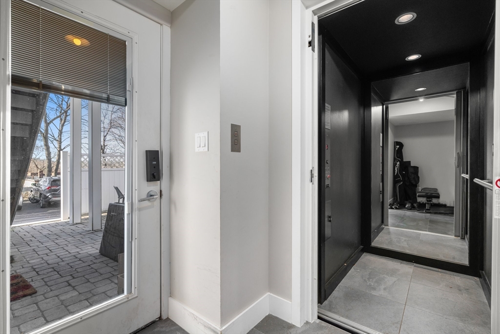 202 Rawson Road, Unit PH 3 Brookline, MA 02445 - Photo 14 of 17 a view of a hallway with a elevator
