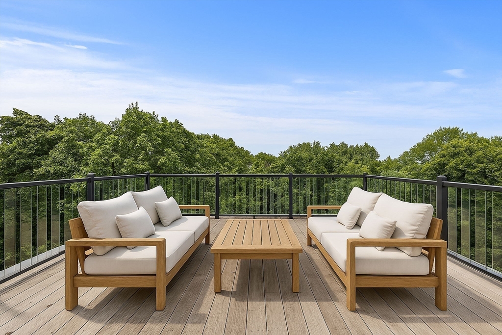 202 Rawson Road, Unit PH 3 Brookline, MA 02445 - Photo 15 of 17 a view of sitting area with furniture and wooden floor