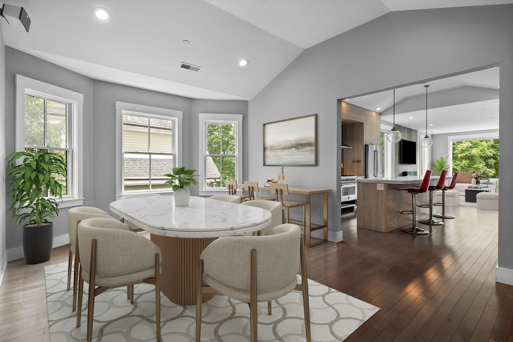 202 Rawson Road, Unit PH 3 Brookline, MA 02445 - Photo 5 of 17 a view of a dining room with furniture and wooden floor