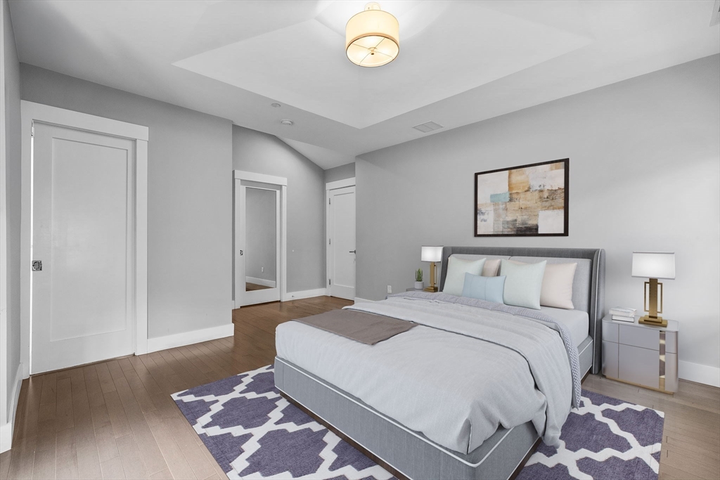 202 Rawson Road, Unit PH 3 Brookline, MA 02445 - Photo 6 of 17 a spacious bedroom with a bed and a lamp on dresser