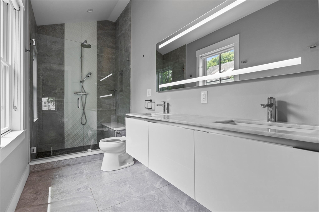 202 Rawson Road, Unit PH 3 Brookline, MA 02445 - Photo 8 of 17 a bathroom with a sink toilet and shower