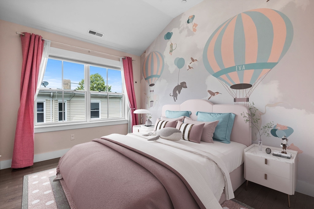 202 Rawson Road, Unit PH 3 Brookline, MA 02445 - Photo 9 of 17 a bedroom with bed and a large mirror