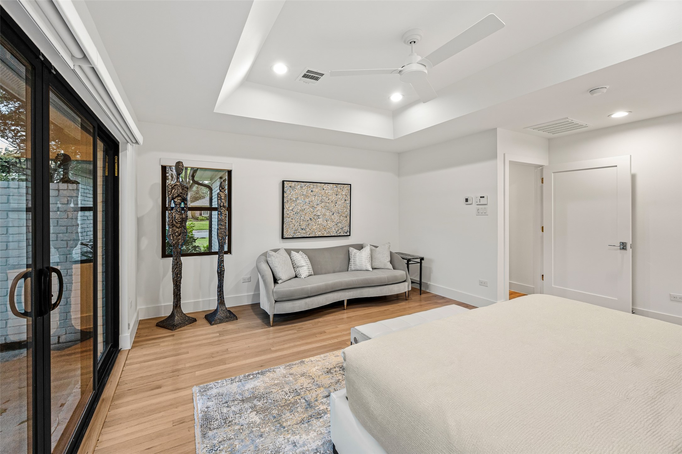 5658 Del Monte Drive Houston, TX 77056 - Photo 15 of 35 a bedroom with a large bed and a couch