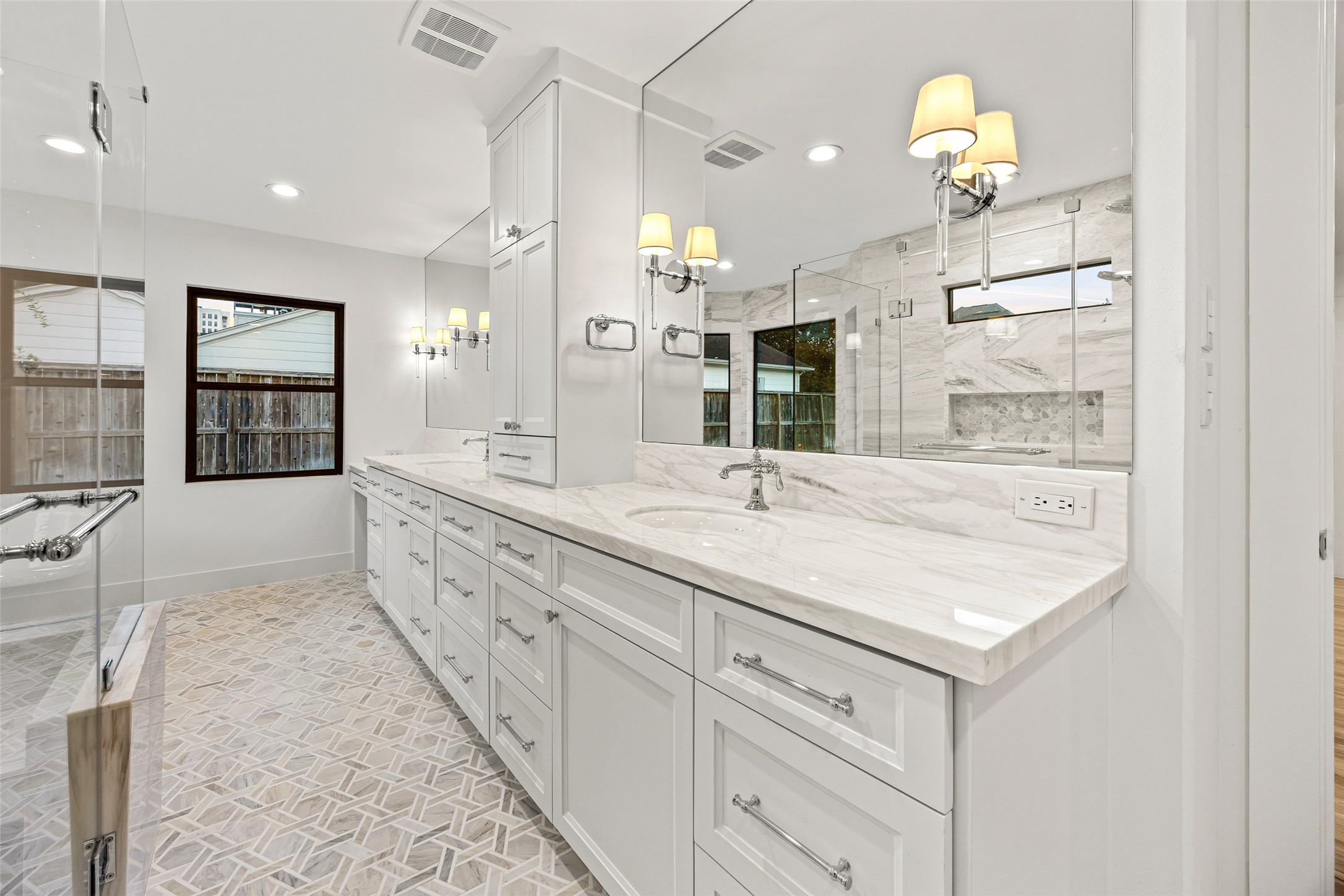 5658 Del Monte Drive Houston, TX 77056 - Photo 20 of 35 a bathroom with a sink double vanity and a mirror