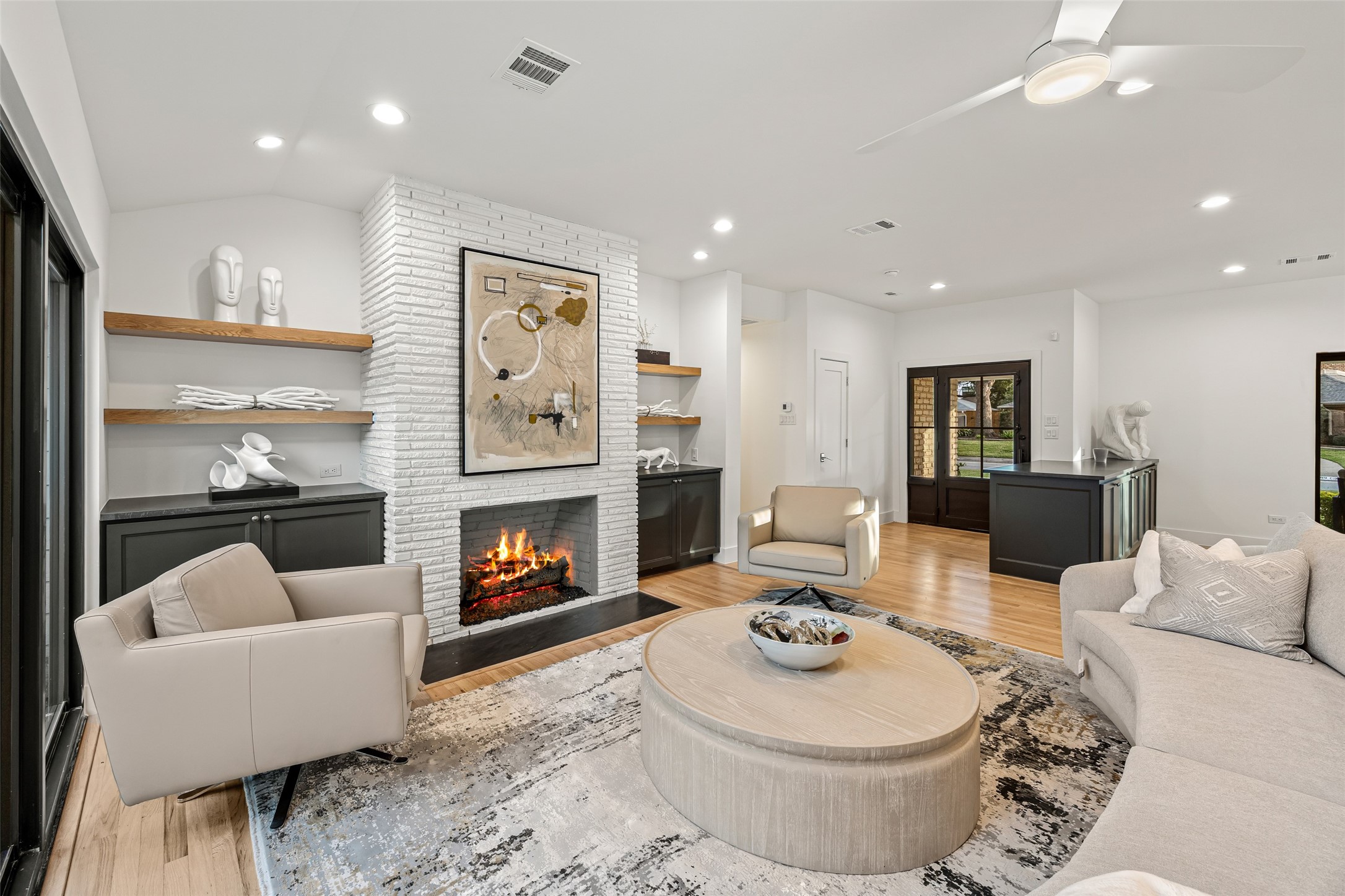 5658 Del Monte Drive Houston, TX 77056 - Photo 25 of 35 a living room with furniture and a fireplace
