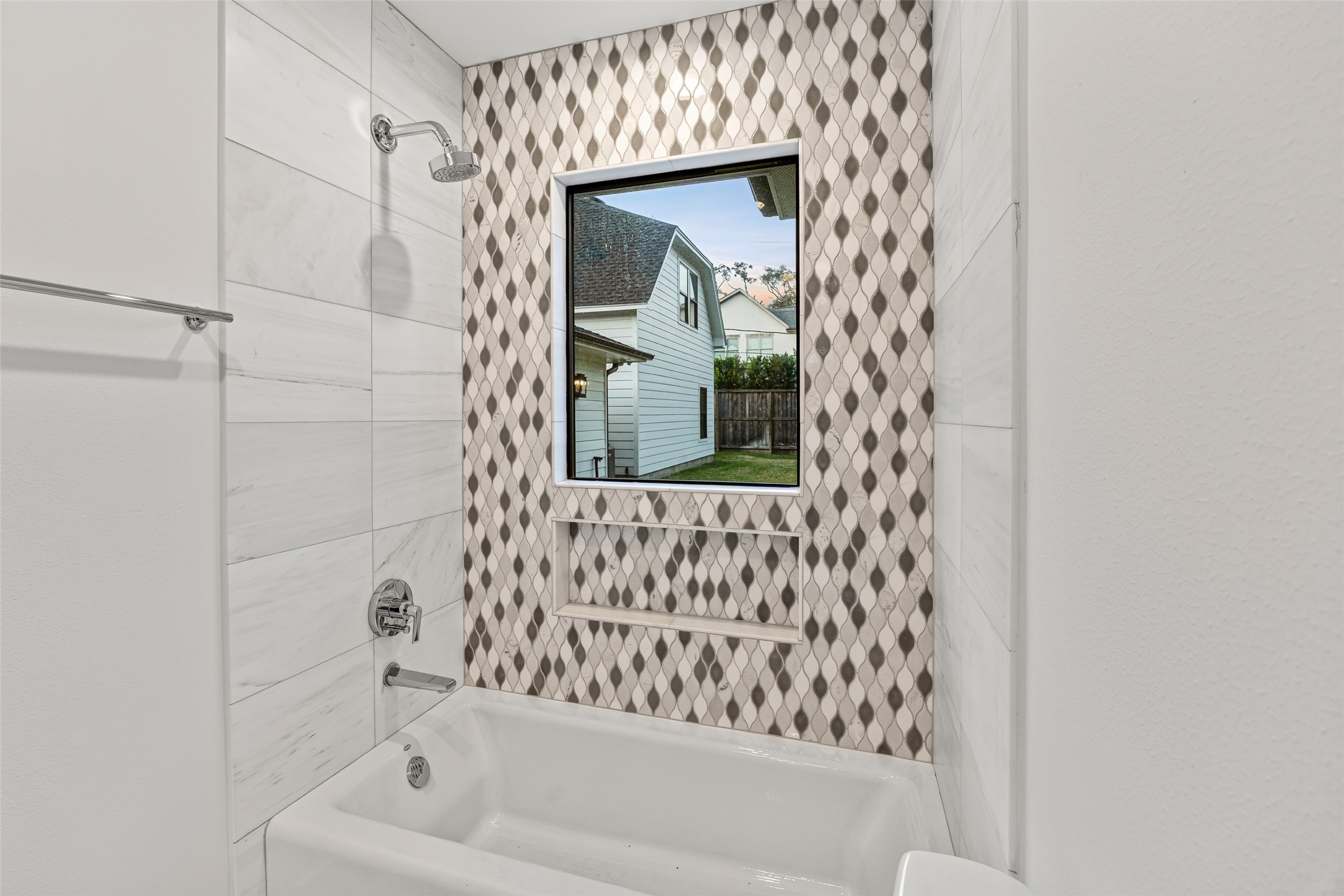 5658 Del Monte Drive Houston, TX 77056 - Photo 32 of 35 a bathroom with a bathtub and shower