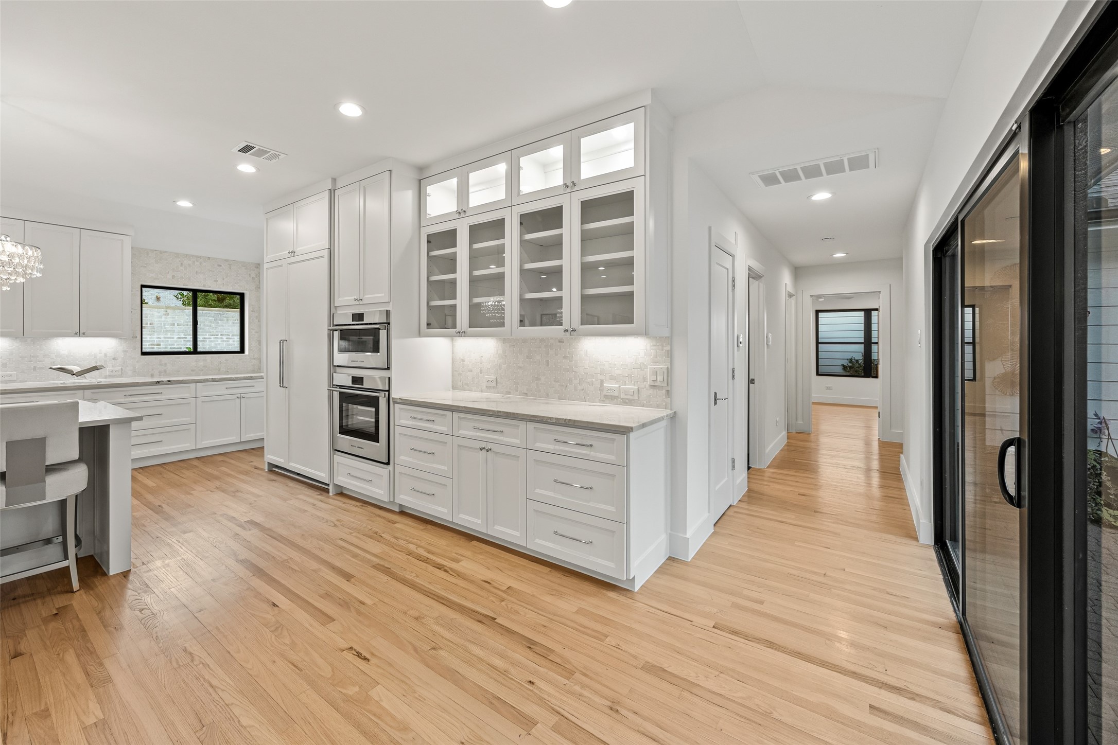 5658 Del Monte Drive Houston, TX 77056 - Photo 5 of 35 a large white kitchen with a large window