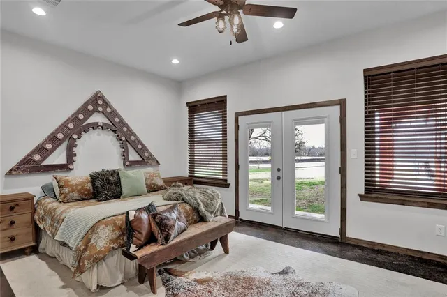 a bedroom with a bed and window