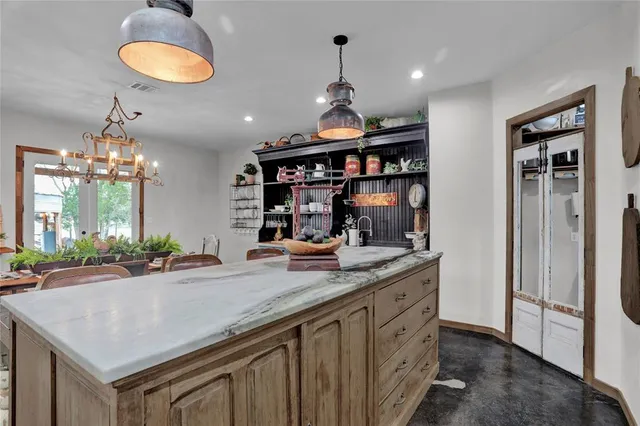 a kitchen with sink and cabinets