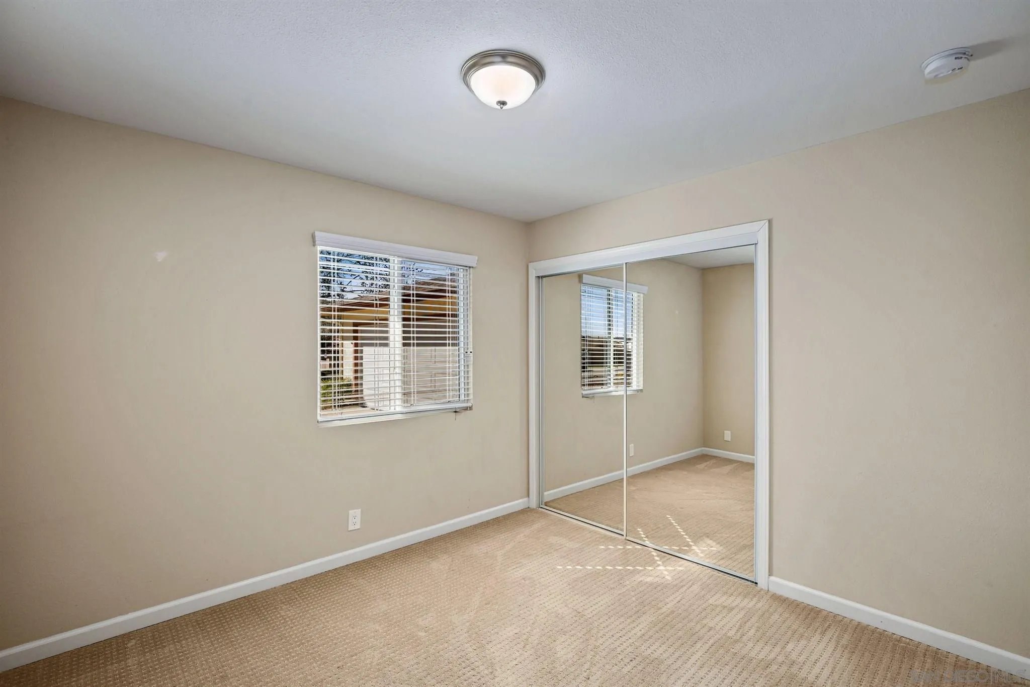 13441 Tobiasson Road Poway, CA 92064 - Photo 19 of 29 an empty room with fan and windows
