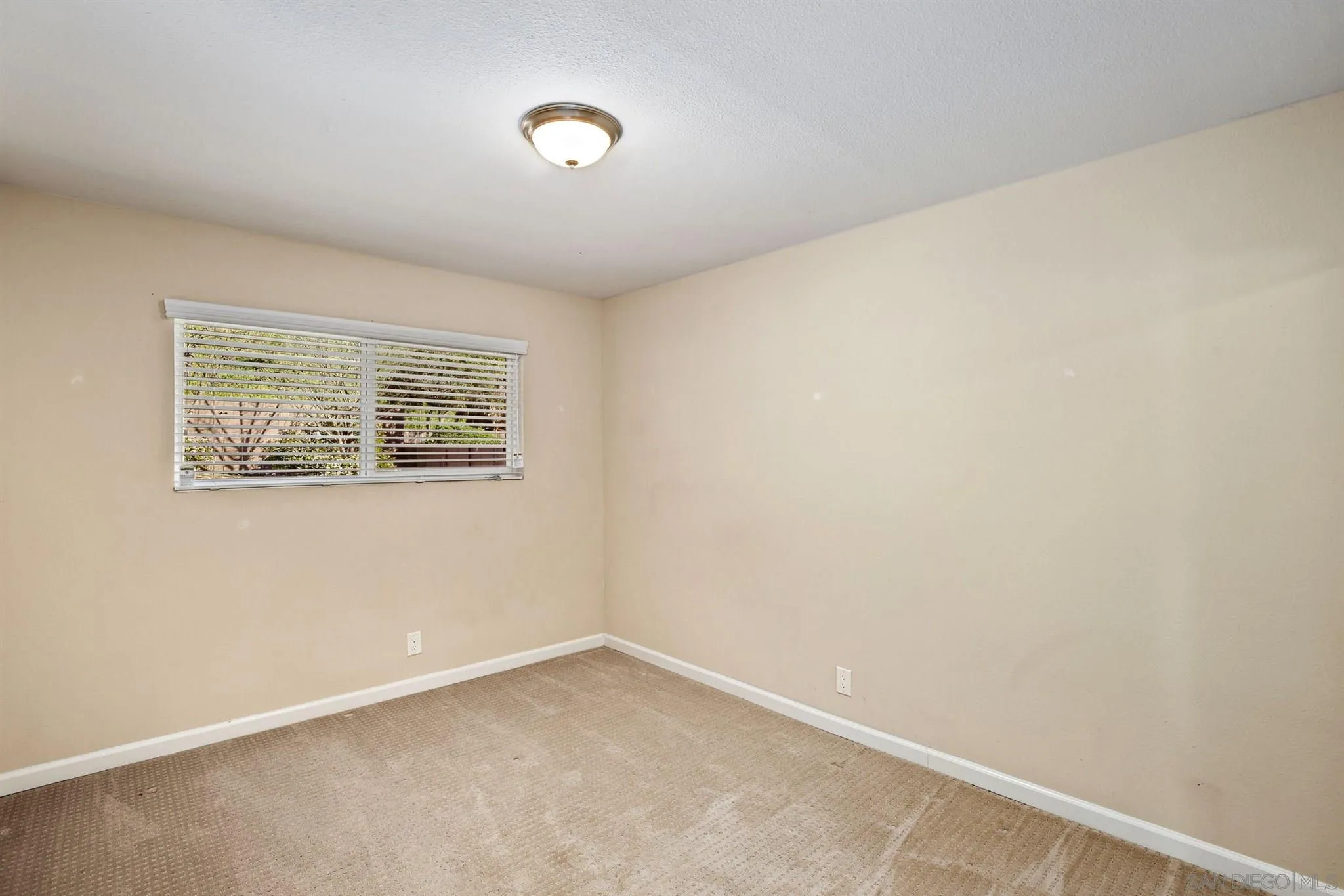 13441 Tobiasson Road Poway, CA 92064 - Photo 21 of 29 an empty room with a window