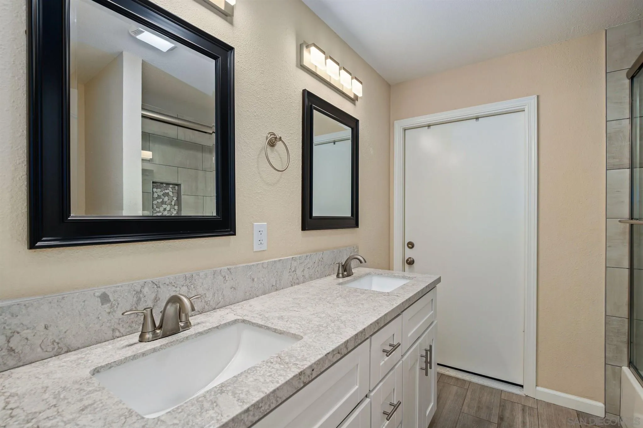 13441 Tobiasson Road Poway, CA 92064 - Photo 22 of 29 a bathroom with a granite countertop double vanity sink and mirror