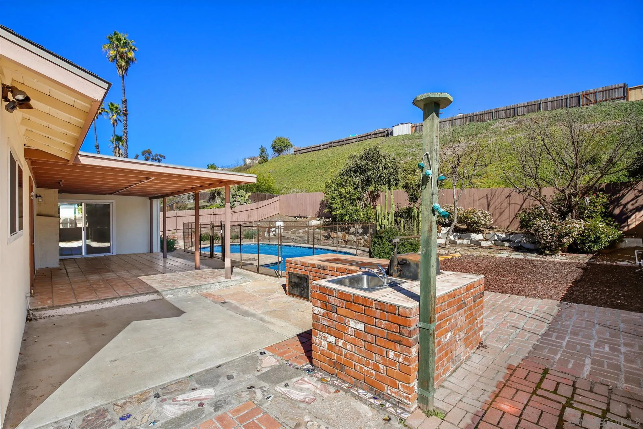 13441 Tobiasson Road Poway, CA 92064 - Photo 26 of 29 a view of a patio with a table and chairs