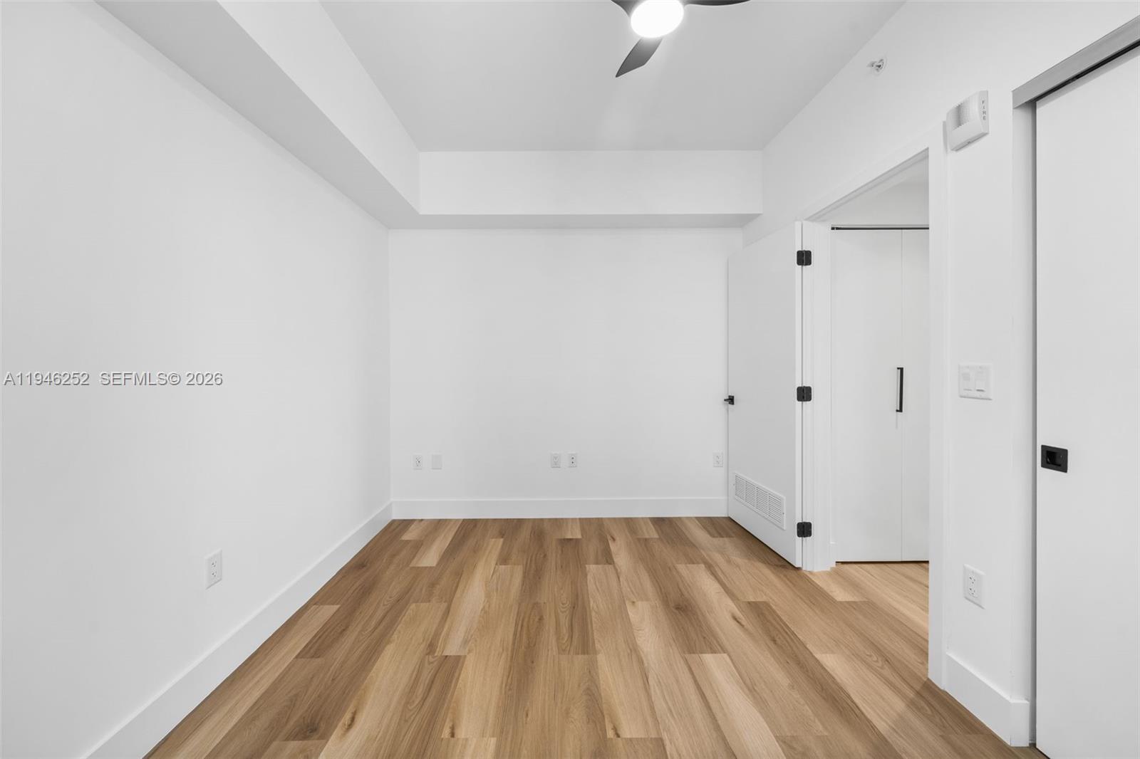 650 Southwest 1st Street, Unit 306 Miami, FL 33130 - Photo 13 of 16 a view of a room with wooden floor and small staircase