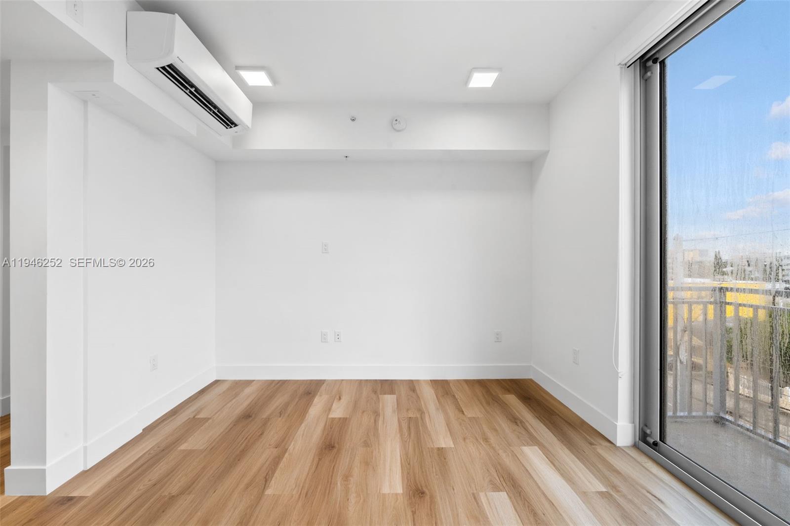 650 Southwest 1st Street, Unit 306 Miami, FL 33130 - Photo 5 of 16 a view of a room with wooden floor and outdoor space