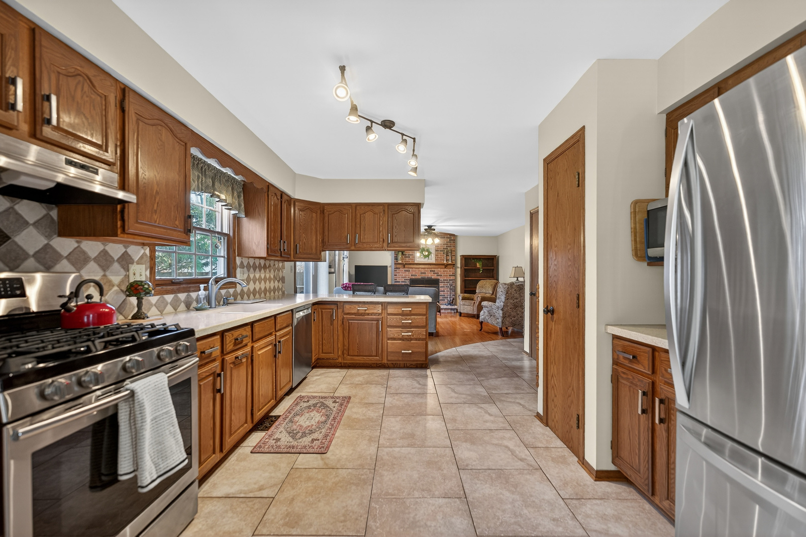 1524 John Street Sycamore, IL 60178 - Photo 11 of 52 a kitchen with stainless steel appliances granite countertop a refrigerator a sink dishwasher a stove and a refrigerator