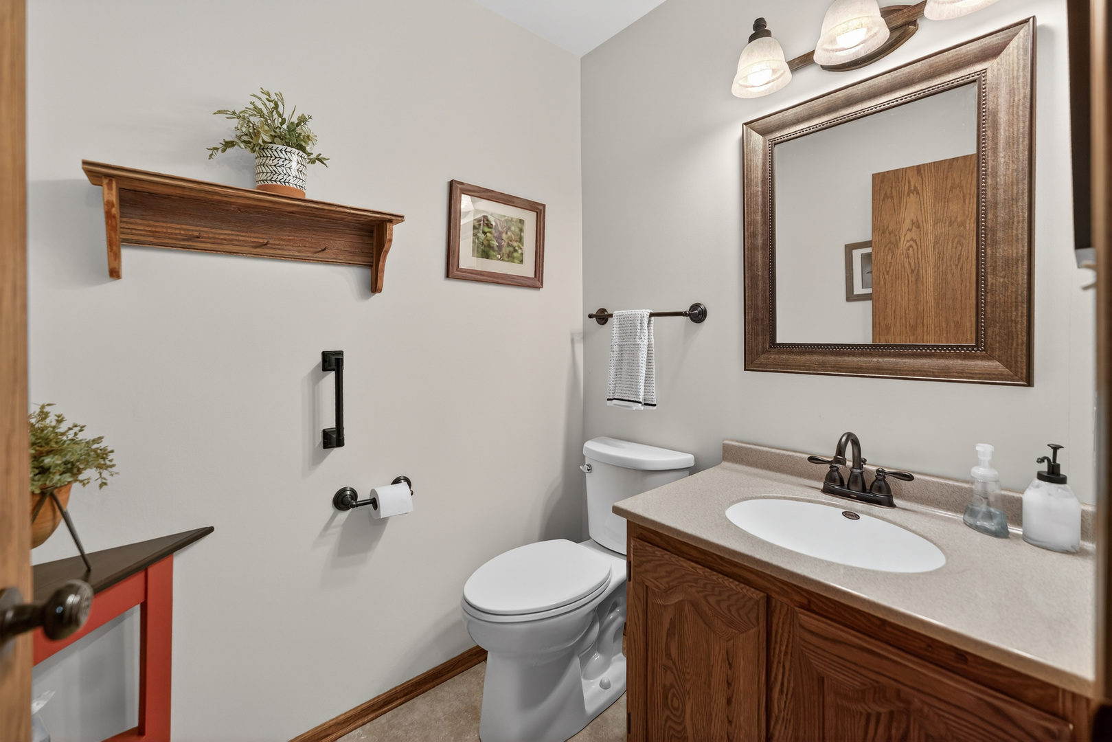 1524 John Street Sycamore, IL 60178 - Photo 17 of 52 a bathroom with a toilet a sink and mirror