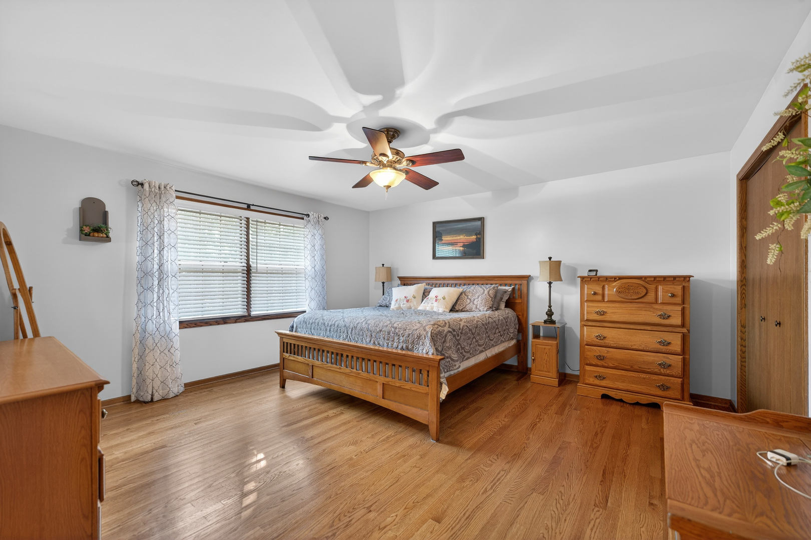 1524 John Street Sycamore, IL 60178 - Photo 19 of 52 a bedroom with a bed and a ceiling fan