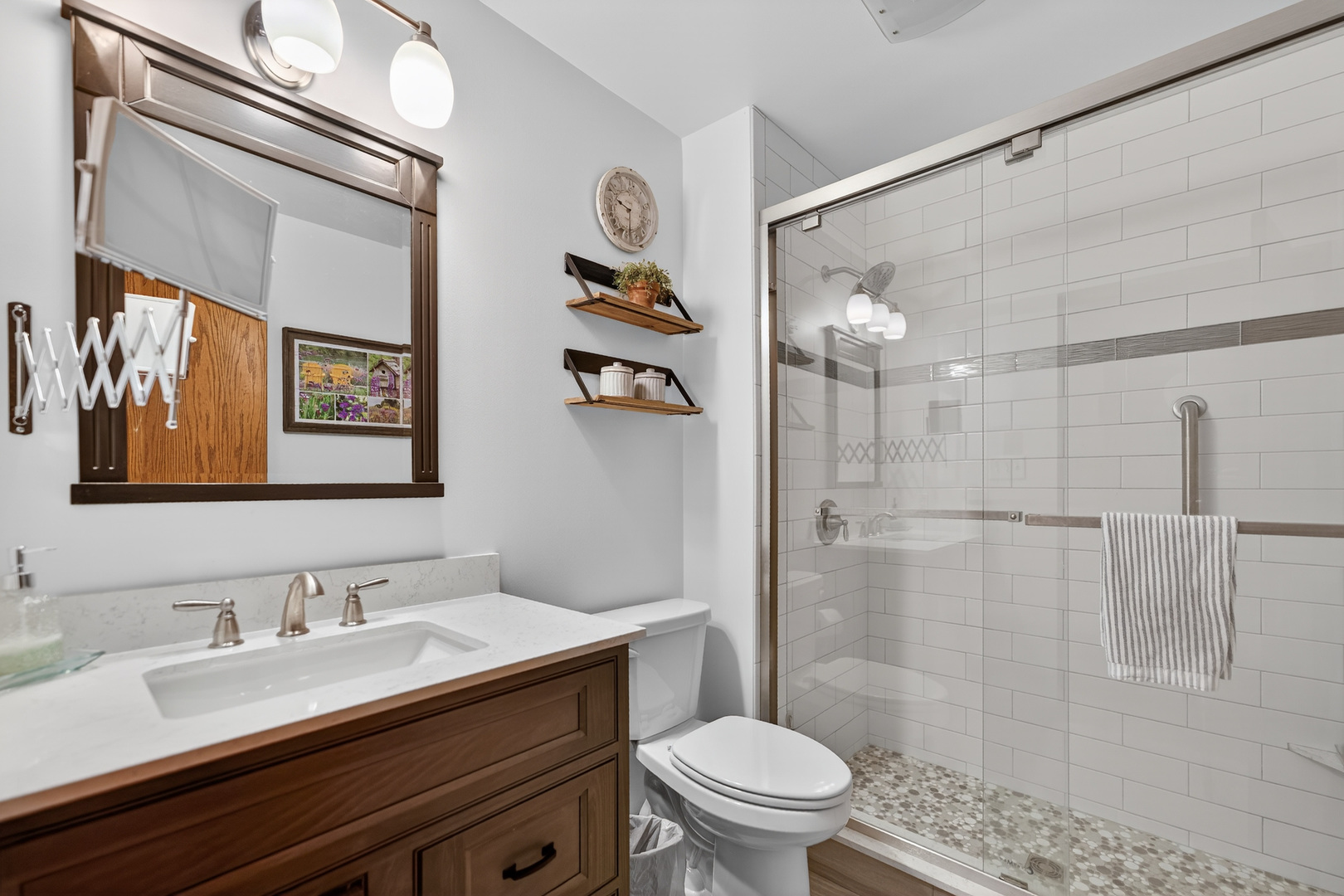 1524 John Street Sycamore, IL 60178 - Photo 21 of 52 a bathroom with a granite countertop sink a toilet a shower and a mirror