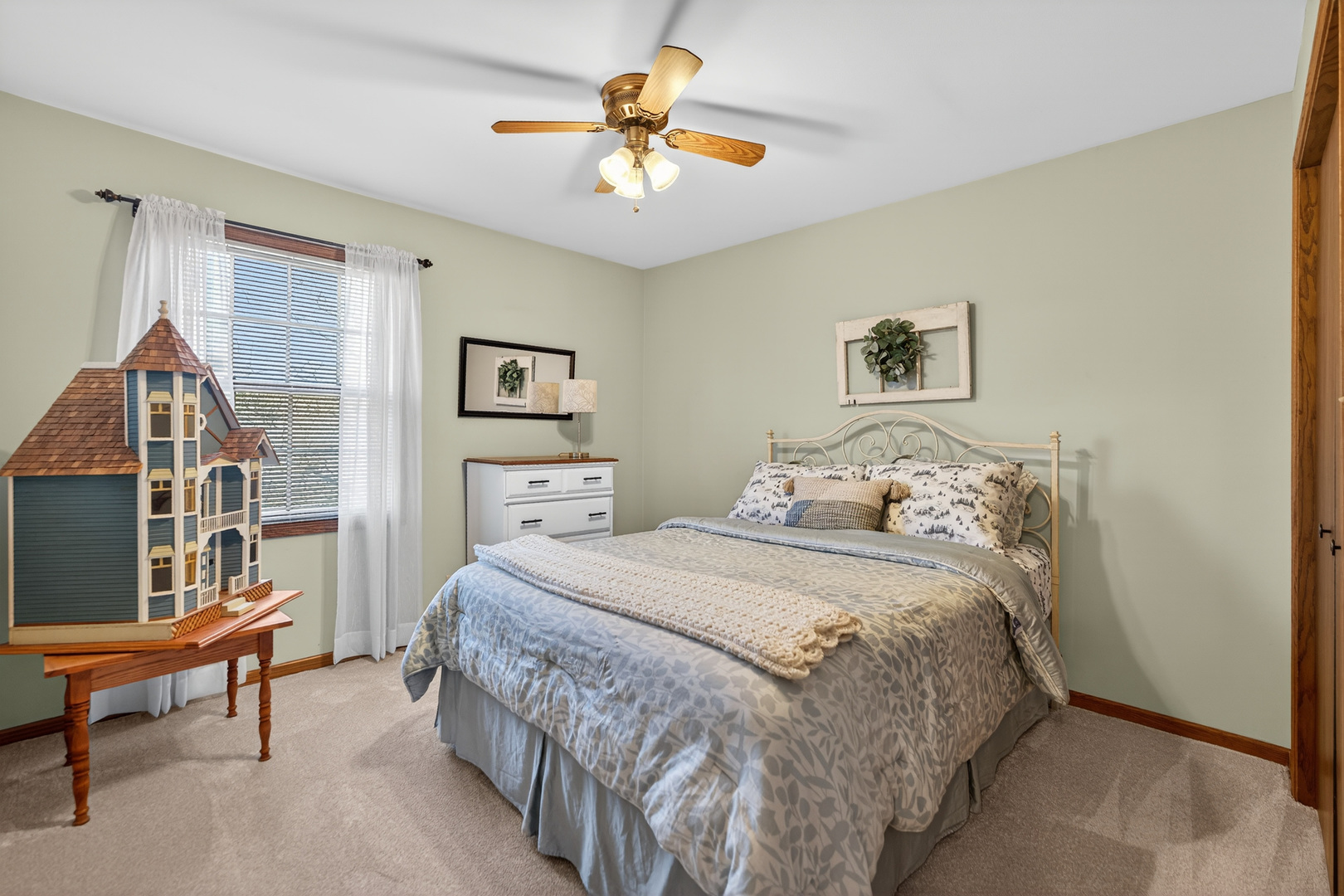 1524 John Street Sycamore, IL 60178 - Photo 23 of 52 a bedroom with a bed and a chandelier