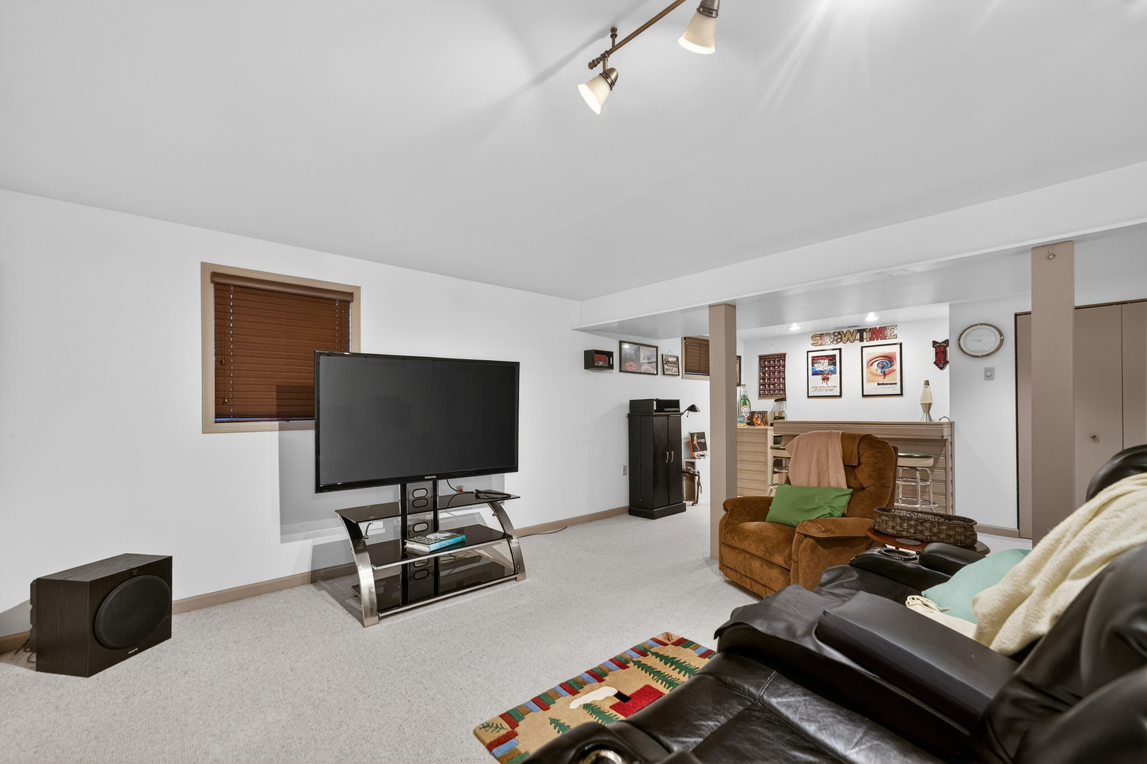 1524 John Street Sycamore, IL 60178 - Photo 27 of 52 a living room with furniture and a flat screen tv