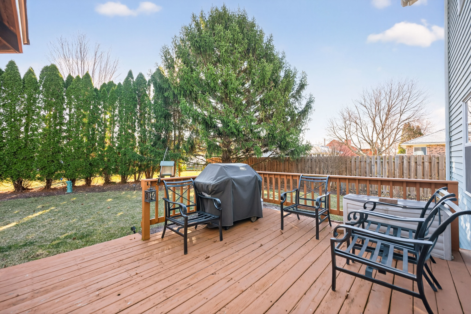 1524 John Street Sycamore, IL 60178 - Photo 32 of 52 a view of a chairs and table on the wooden deck