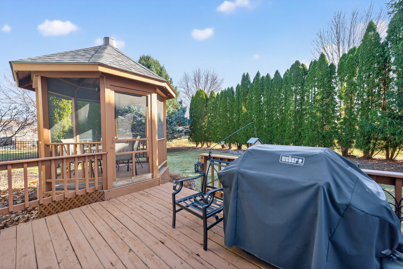 1524 John Street Sycamore, IL 60178 - Photo 33 of 52 a view of a patio with table and chairs and wooden floor
