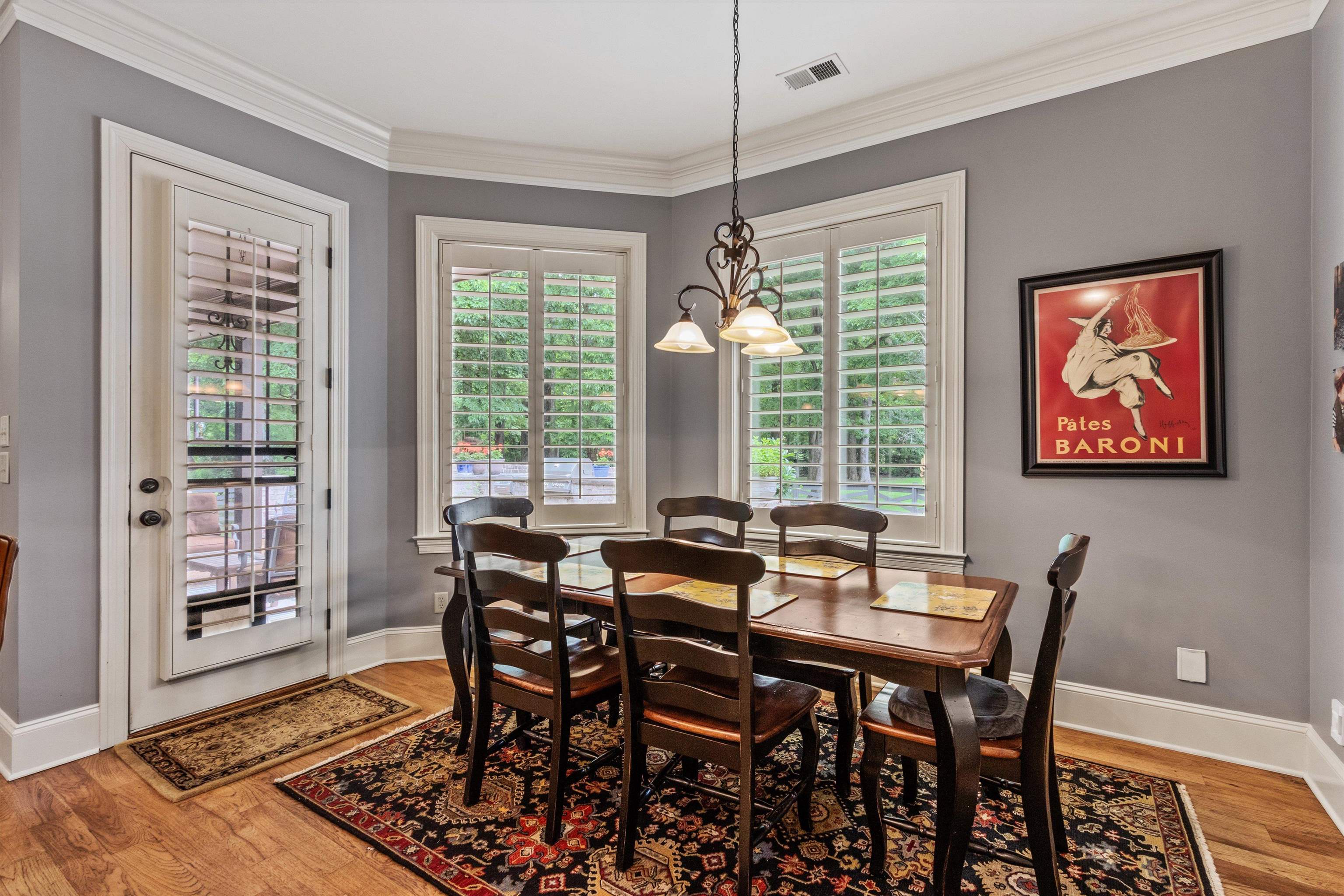 150 Ridgecrest Drive Arlington, TN 38002 - Photo 16 of 40 Dining area featuring wood-finish flooring, crown molding, and neutral wall tones